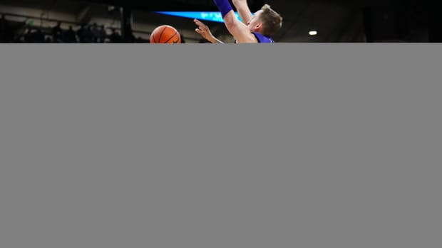 Dec 29, 2023; Boulder, Colorado, USA; Colorado Buffaloes guard KJ Simpson (2) shoots the ball past Washington Huskies forward Moses Wood (13) in the second half at the CU Events Center
